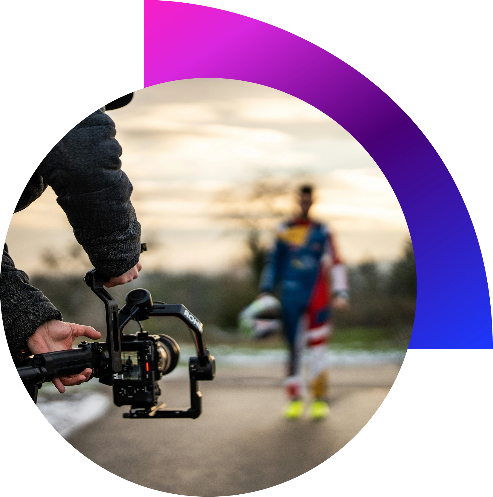 “Videographer capturing fast-paced sports action with gimbal and telephoto lens during outdoor match.”