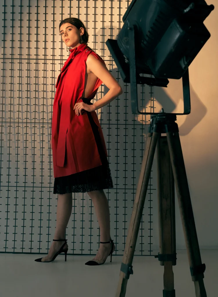 “Fashion videographer recording designer collection video with professional camera equipment.”