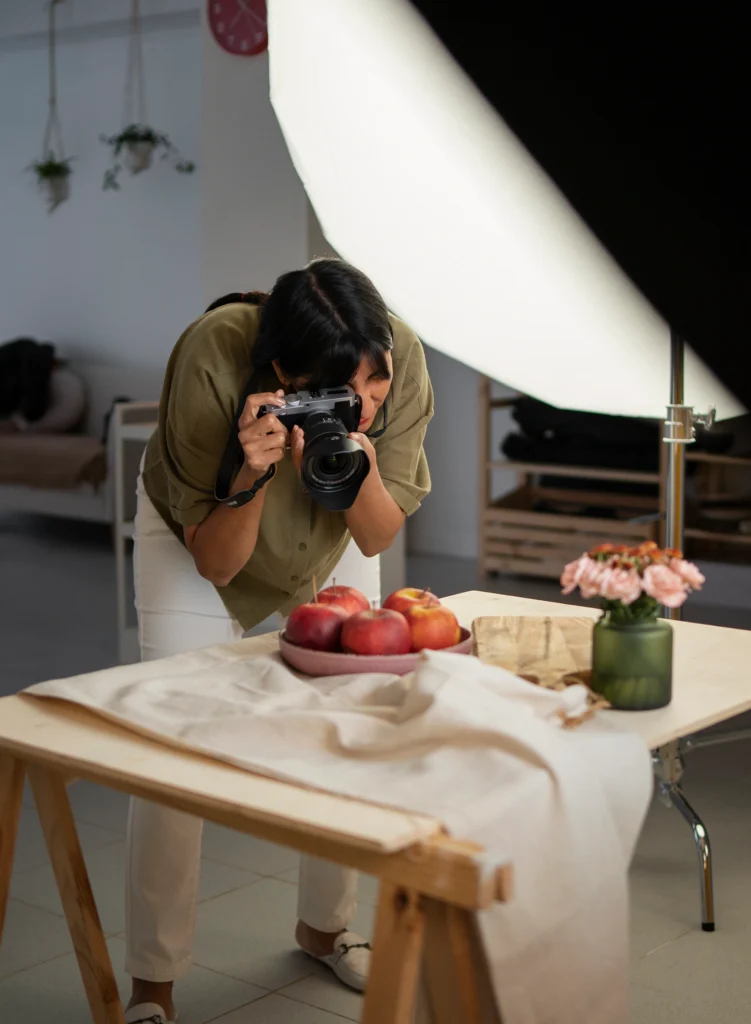 “Product videography setup with softbox lighting, rotating turntable and DSLR camera capturing product angles.”