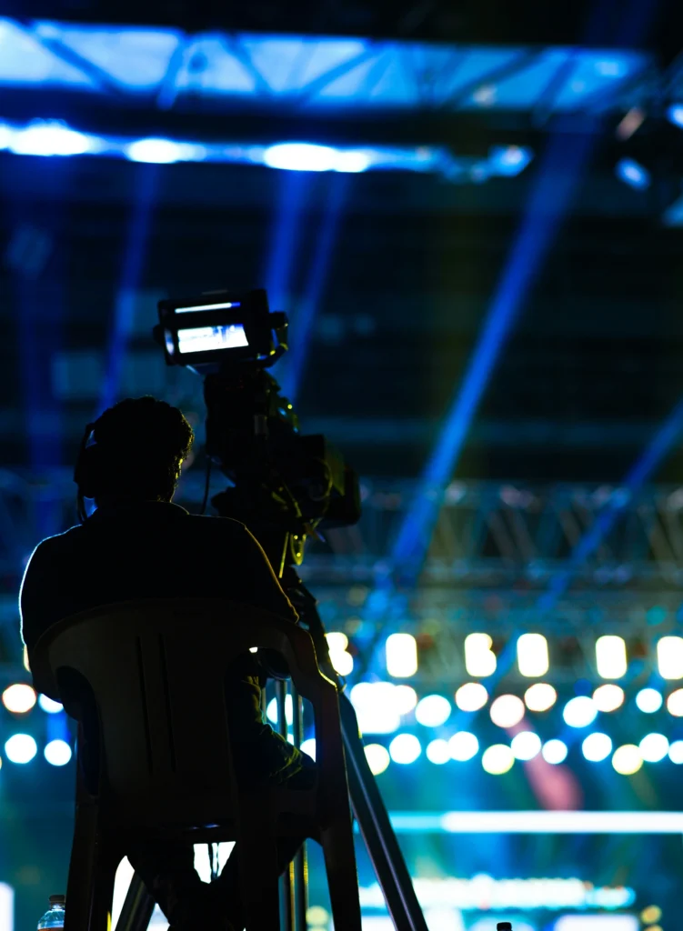 “Event videography crew capturing wedding ceremony video with multiple cameras and stabilized rig”
